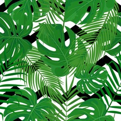 Vector seamless pattern with tropical green leaves on zig zag background. Summer print with exotic plants and graphic ornate for print, textile, fabric, decor, design.