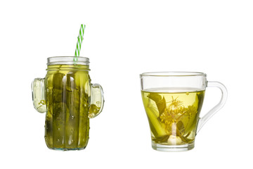Glass jar with a straw and a glass of cucumber pickle isolated on white background
