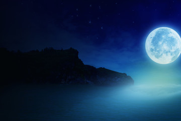 Super moon. a bright full moon and stars above the seascapes at night. background to the tranquility of nature, outdoor at night