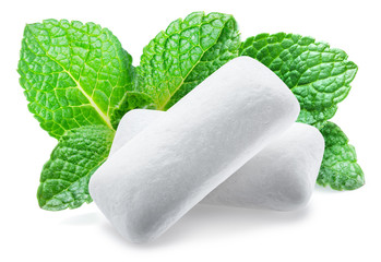 Chewing gum pieces and mint leaves on white background. Clipping path. © volff