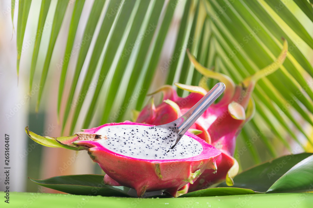 Wall mural Fresh, tasty tropic, exotic dragon pitahya dragon fruit near palms