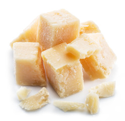 Parmesan cheese cubes isolated on white background.