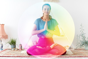 mindfulness, spirituality and healthy lifestyle concept - woman meditating in lotus pose at yoga...