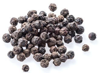 Black peppercorns isolated on white background.