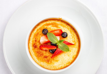 Baked cottage cheese dessert with strawberry on white background