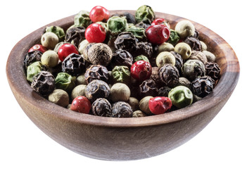 Colorful peppercorns in wooden bowl on white background. Clipping path.