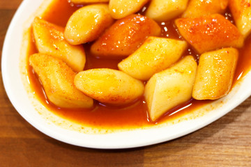 Korean tokkoki food on a wooden table close-up, top view