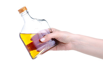 bottle cognac alcohol in hand on a white background. Isolation