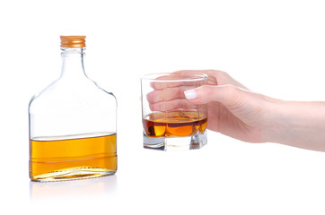 Glass with cognac and bottle cognac on a white background. Isolation