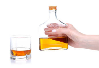 Glass with cognac and bottle cognac on a white background. Isolation