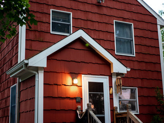 red suburban house back door and facade at dusk