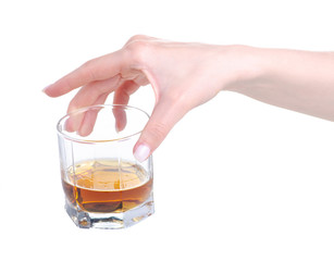 Glass with cognac brandy alcohol in hand on a white background. Isolation