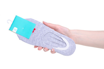 gray no show socks in hand on white background isolation