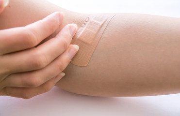 adhesive plaster on injury after blood test injection