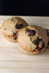 Homemade muffins on wooden table