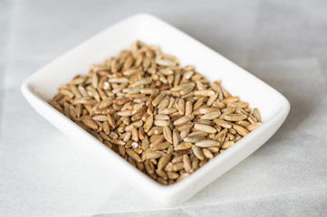 Rye grains on a white plate