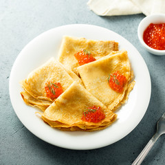 Homemade pancakes with red caviar