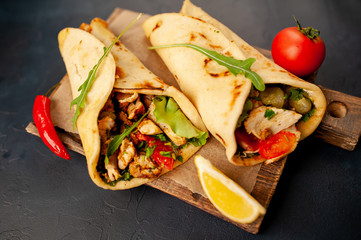 delicious mexican tacos with salad on concrete background. mexican cuisine