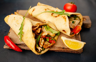 delicious mexican tacos with salad on concrete background. mexican cuisine