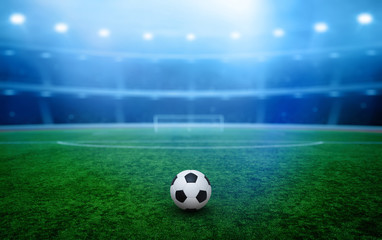 Soccer ball on stadium with illumination