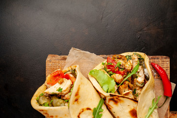 delicious mexican tacos with salad on concrete background. mexican cuisine