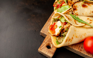 delicious mexican tacos with salad on concrete background. mexican cuisine