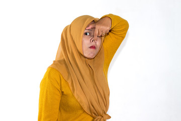 funny expression of Muslim asian woman wearing hijab isolated over white background