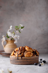 chocolate and blueberry pancakes in a ceramic bowl