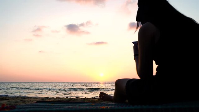 Phuket Sea Nai Thon Beach Woman sitting sunset, Thailand.