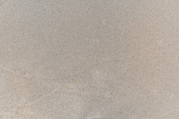 Fototapeta na wymiar Sand texture background, natural sand at the beach close up.
