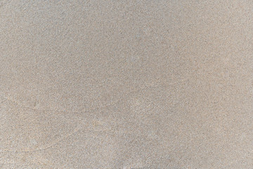 Sand texture background, natural sand at the beach close up.