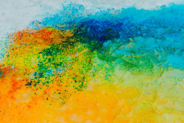Obraz na płótnie Canvas Background of colorful Holi powder on the snow