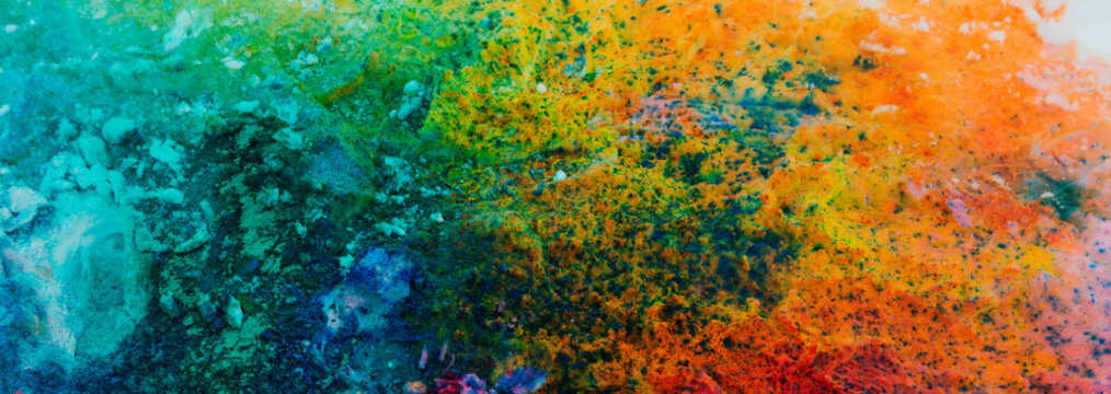 Banner background of colorful Holi powder on the snow