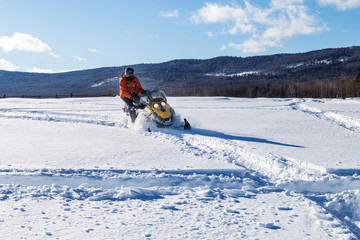 Athlete on a snowmobile.