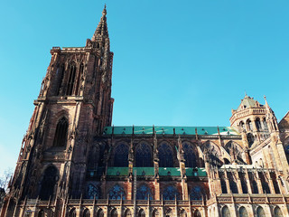 Side view of Roman Catholic Cathedral Notre Dame de Strasbourg in Alsace, France. Majestic gothic...