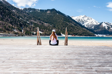 Woman sitting on jetty