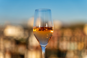 Wine glass with Porto, Portugal buildings reflecting in the wine