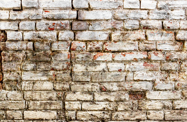 Old brick wall with white paint background texture close up , industrial detail