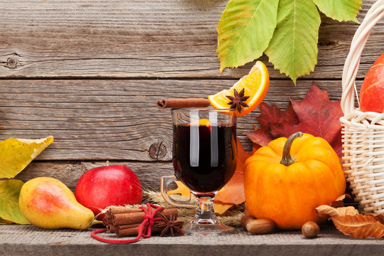 Autumn still life with mulled wine and pumpkins