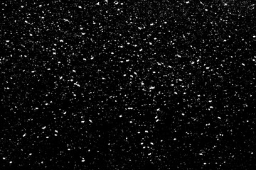 Chaotic white bokeh on a black background, light spots texture, abstraction, falling snow, star sky, bright glare of light texture