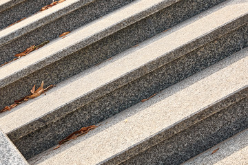 marble, granite steps of gray color with structure, parallel lines are located diagonally