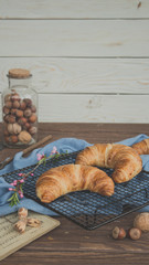 freshly golden baked croissants rustic wood, from above.