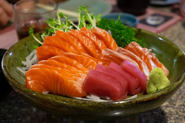 Raw salmon slice or salmon sashimi in Japanese style fresh serve with fresh wasabi.