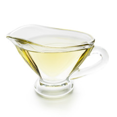 Olive oil in glass jar on white