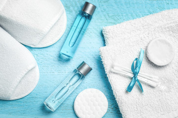 Personal hygiene items from a hotel set on a blue wooden background
