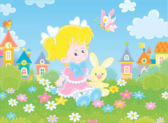 Obraz na płótnie Canvas Cute little girl in a beautiful pink dress sitting with a small toy rabbit among flowers on a green lawn against a background of colorful houses of a small town, vector illustration in a cartoon style