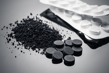 Activated carbon in granular and in tablets with blister packs
