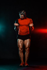 Fototapeta premium Muscular fitness sports man, atlete with dumbbell in fitness gym. Energy and power.