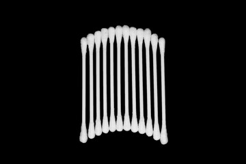 White cotton buds isolated on black background