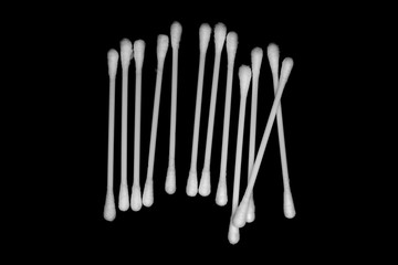 White cotton buds isolated on black background